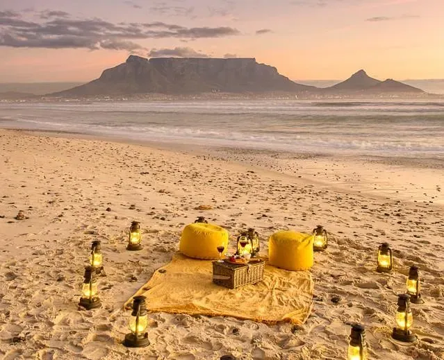 Sunset beach picnic set up on the sand at Atlantic Palms